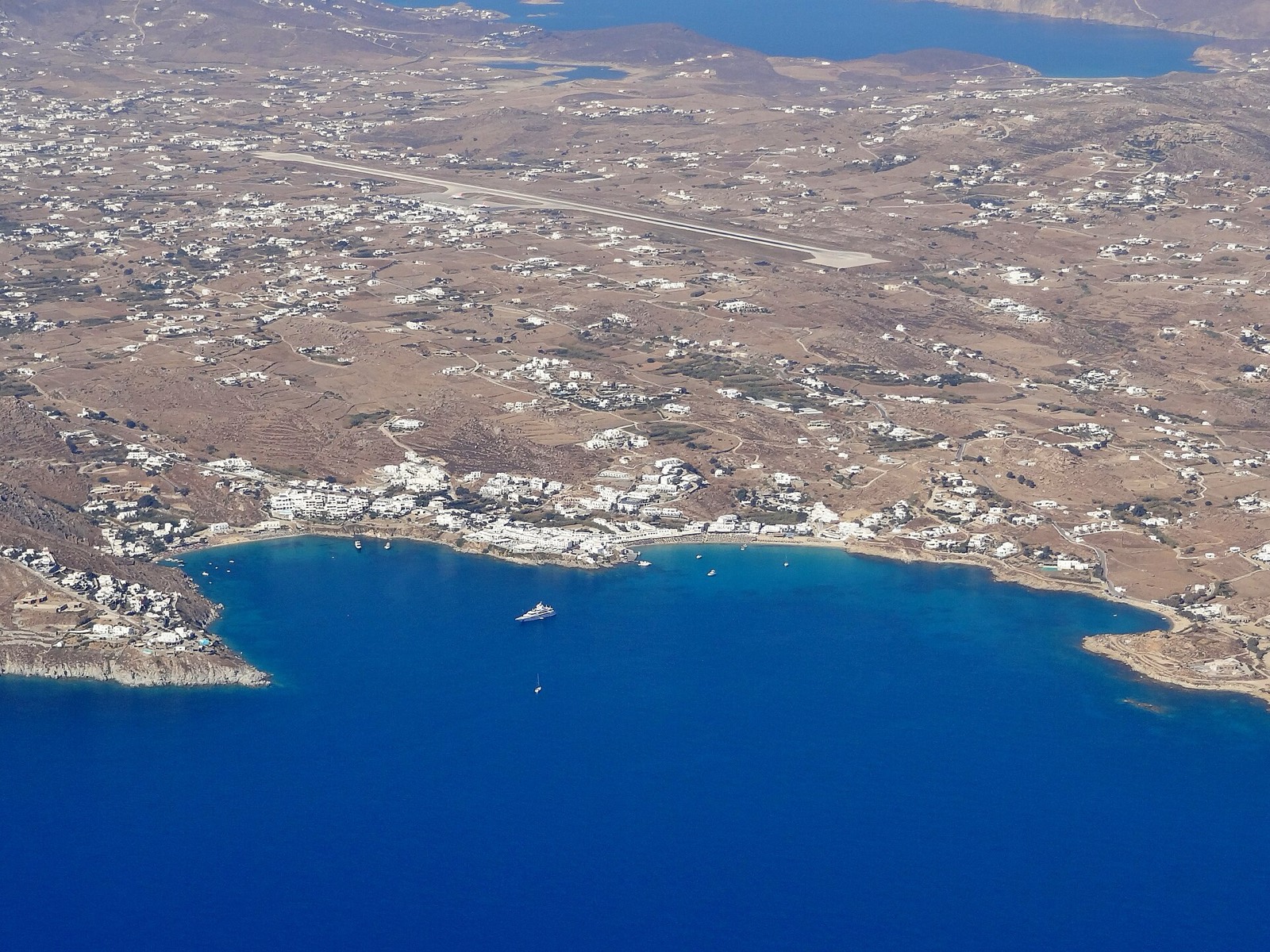 Aerial view of Platis Gialos and the south-coast bays